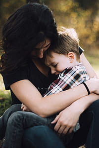 woman carrying child thumbnail