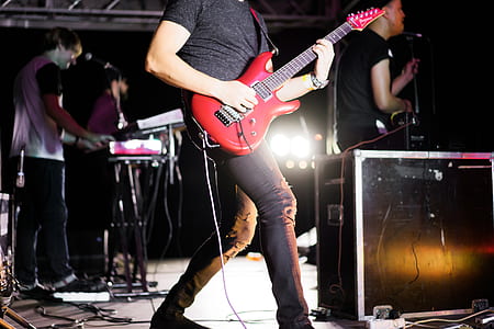 person playing red electric guitar thumbnail