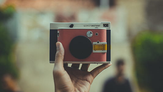 person holding camera thumbnail