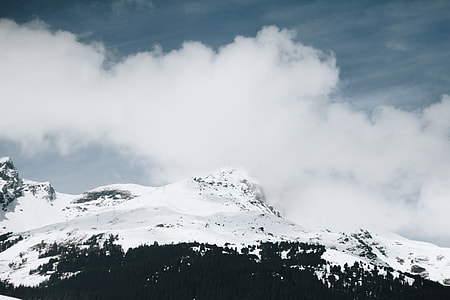 snowcapped mountain under white cloudy sky thumbnail