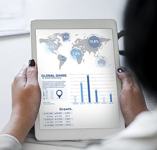 person holding white tablet computer thumbnail