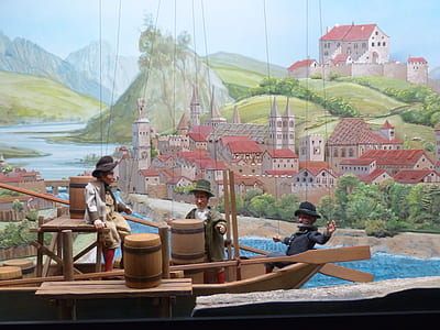 three male puppets in boat thumbnail