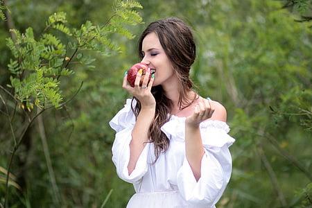 woman biting apple fruit thumbnail