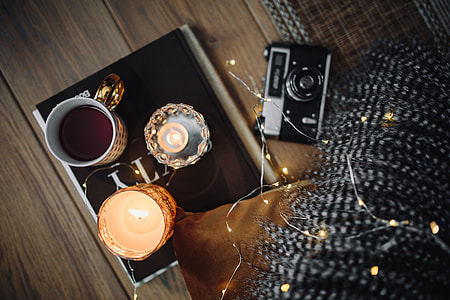 Old camera, mug with tea and books thumbnail