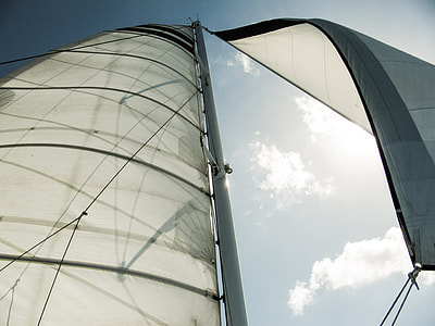 low angle photography of white sailboat during daytime thumbnail