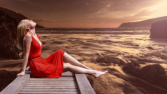 woman sitting on brown dock thumbnail