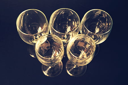 four clear wine glasses on black surface thumbnail