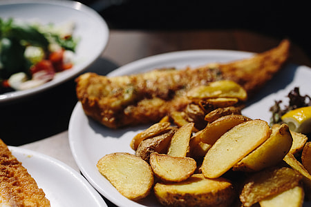 Dinner at reastaurant: Fish and Roasted Potatoes with Fresh Greek Salad thumbnail