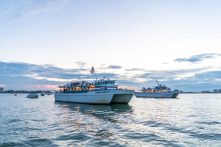 Two Yachts Floating on Body of Water thumbnail
