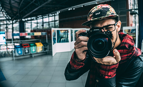 Man taking photos with Camera thumbnail