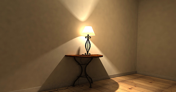 brown wooden side table with black table lamp on top thumbnail