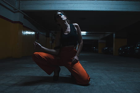 Woman Wearing Tank Top and Kneeling on the Floor thumbnail