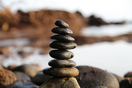 selective focus photography of stones balanced on rock thumbnail