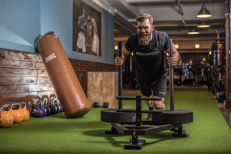 man pushing the exercise equipment thumbnail