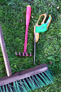 three assorted-type garden tools on grass thumbnail
