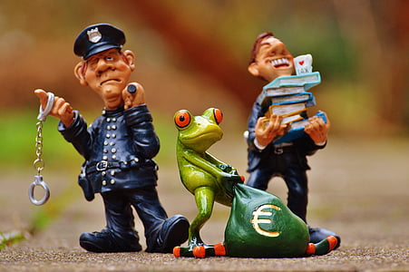 two policemen and frog figurines thumbnail