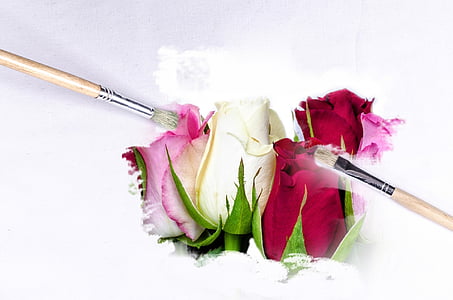 two brown paintbrushes on white and red flower painting thumbnail