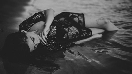 woman wearing black see-through dress thumbnail