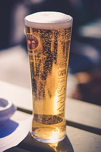 clear Amster pilsner glass filled with yellow liquid thumbnail