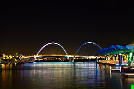 body of water surrounded by lights thumbnail