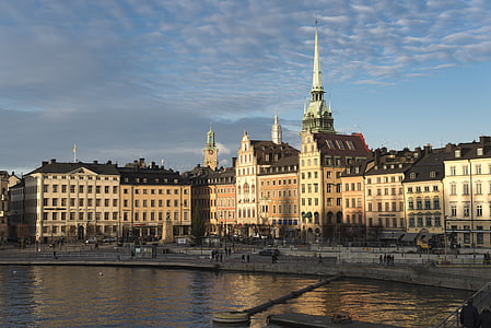 buildings near body of water at daytime thumbnail