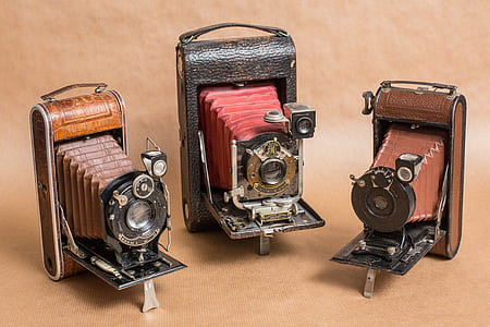 three vintage brown cameras thumbnail