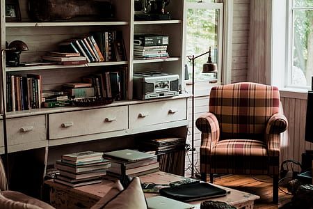 brown and black plaid armchair near white wooden bookshelf thumbnail