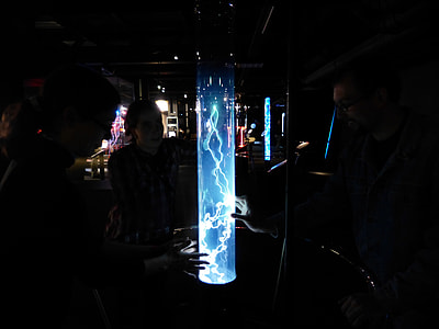 group of people touching plasma light thumbnail