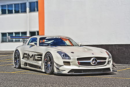 white Mercedes-Benz coupe near white wall thumbnail