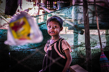 boy standing near the green textile thumbnail
