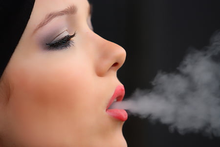 woman wearing make up is smoking thumbnail