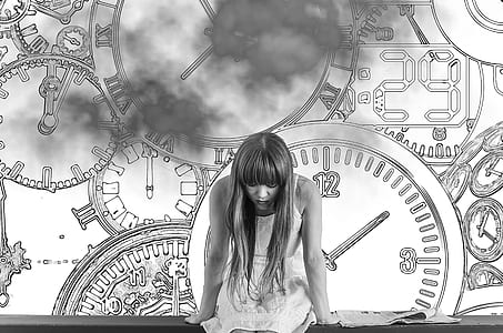 grayscale photo of woman in dress with clocks as background thumbnail