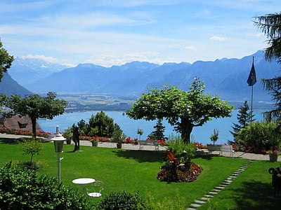 landscape photography of mountain and body of water thumbnail