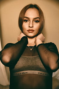 woman holding hair thumbnail