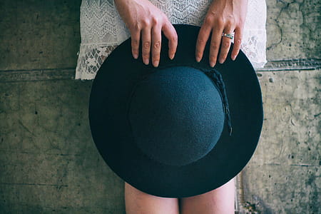 Woman Holding Hat thumbnail