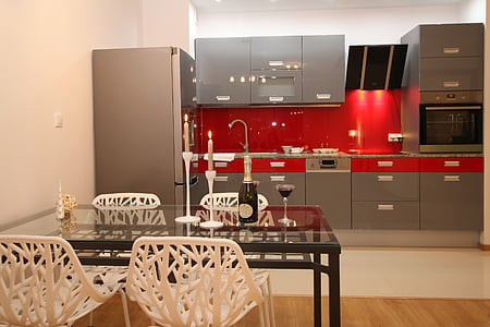 empty table and chair beside refrigerator thumbnail
