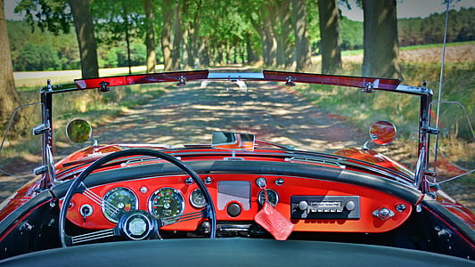 red and black car on the road thumbnail