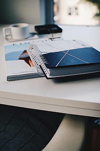 close photography of two notebooks on top of white table thumbnail