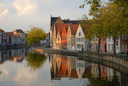 assorted-color building beside canal during daytime thumbnail