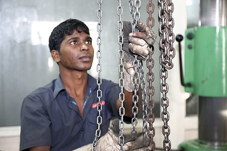 man cleaning rusty chain thumbnail