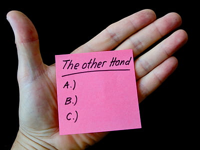 person holding pink sticky note thumbnail