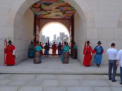 people standing near gate wearing Hanbok suit thumbnail