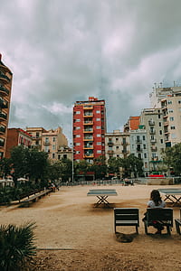 Photography of Girl Sitting on Chair on Park thumbnail