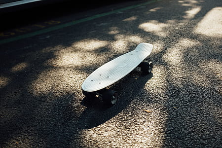 white Penny cruiser board on road thumbnail
