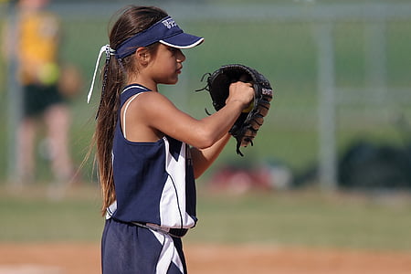 girl playing baseball on field thumbnail