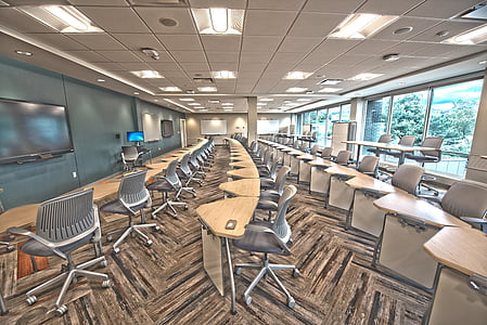 photography of brown and gray rolling chairs inside room during daytime thumbnail