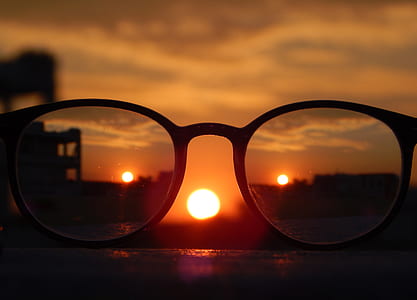 Close-up Photography of Eyeglasses at Golden Hour thumbnail