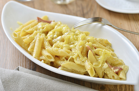 pasta dish on platter with fork on side thumbnail