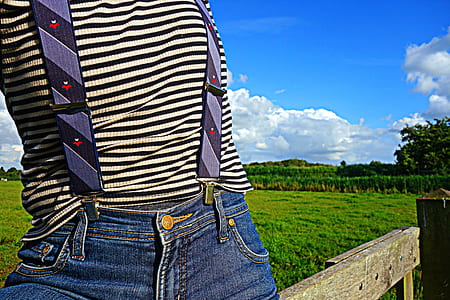 person sitting on wooden fence thumbnail