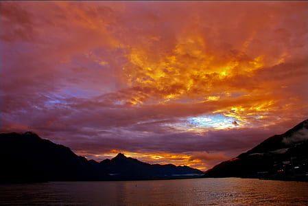 mountain beside body of water thumbnail